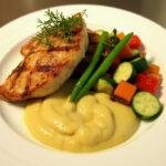 Delicious Roasted Parsnip Puree served with grilled chicken and seasonal vegetables.