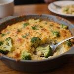 Served Broccoli Au Gratin Rice, golden and cheesy, ready to be enjoyed, highlighting the delicious flavors.