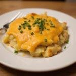 Delicious cheesy smashed potatoes served hot with a golden crust, the perfect side dish for any meal.