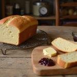 Perfectly baked Grandma Sycamore bread loaf with slices displayed, highlighting the delicious outcome of traditional homemade bread.