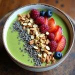 Finished Detoxifying Green Smoothie Bowl with fresh toppings, perfect for a healthy meal.