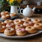 A stunning display of freshly baked donuts on a platter, showcasing the delicious results of using an essential home donut baking pan.