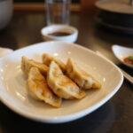 Deliciously presented savory steamed Japanese dumplings, showcasing a traditional gyoza recipe ready to enjoy.