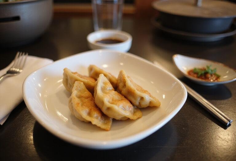 Deliciously presented savory steamed Japanese dumplings, showcasing a traditional gyoza recipe ready to enjoy.
