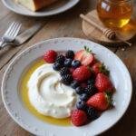 A probiotic yogurt bowl topped with berries and honey showcasing gut-friendly recipes for healthy digestion