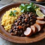 Brazilian feijoada dish with rice, sausage, and beans served on a wooden platter, garnished with cilantro and lemon wedges