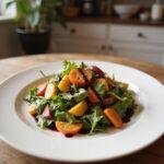Gourmet salad with vibrant vegetables and balsamic glaze, presented on a white plate, highlighting affordable yet impressive home-cooked cuisine.