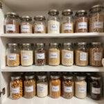 Clean and organized pantry with labeled jars and neatly stacked food items