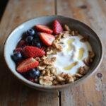 Healthy probiotic-rich yogurt with berries and nuts on a wooden table, supporting immunity boost.