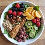 Healthy foods rich in fiber and probiotics, such as leafy greens, berries, nuts, and seeds, promoting gut health and hormone balance.